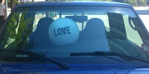 I saw this "Love" ball in the windshield of a parked truck, while on a sunny walk in Vancouver yesterday. Awesome.