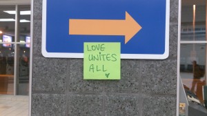 I left this little 'Love unites all' note on the sign that directs passengers to the Baggage claim, at the Saskatoon international airport, earlier this Summer 